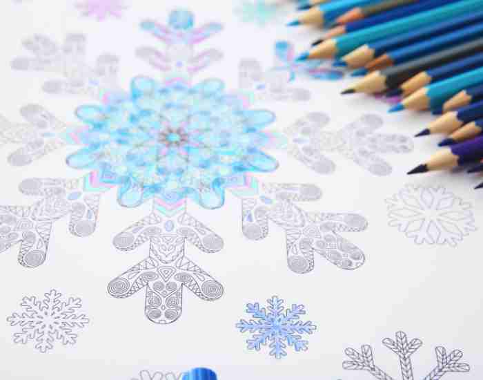 Coloring Zentangle with Pencils on Table